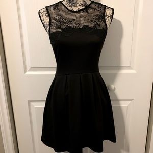 Black cocktail dress with lace detail